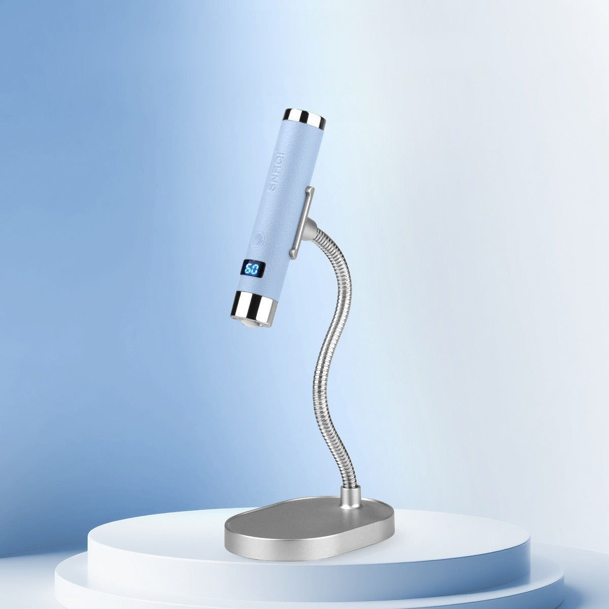 YISS AI Sensor Cordless Nail Lamp in blue on a clean blue studio pedestal