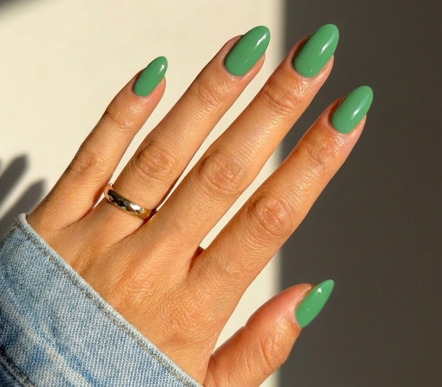 YISS jade green HEMA-free gel polish shade on hand for olive and dusky skin inspiration